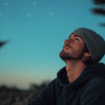 young man looking up into the sky